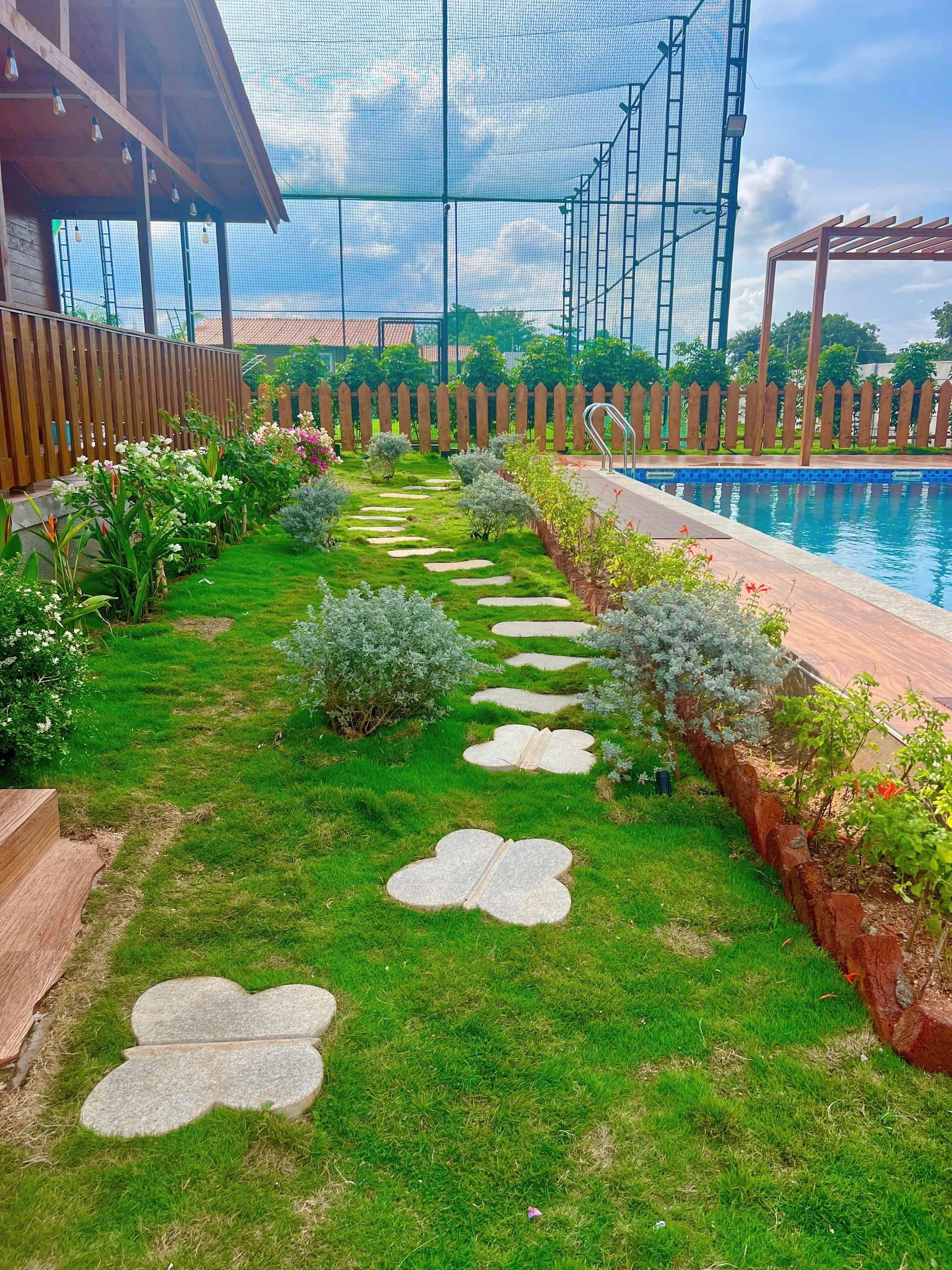 Stepping-stone garden path beside the pool