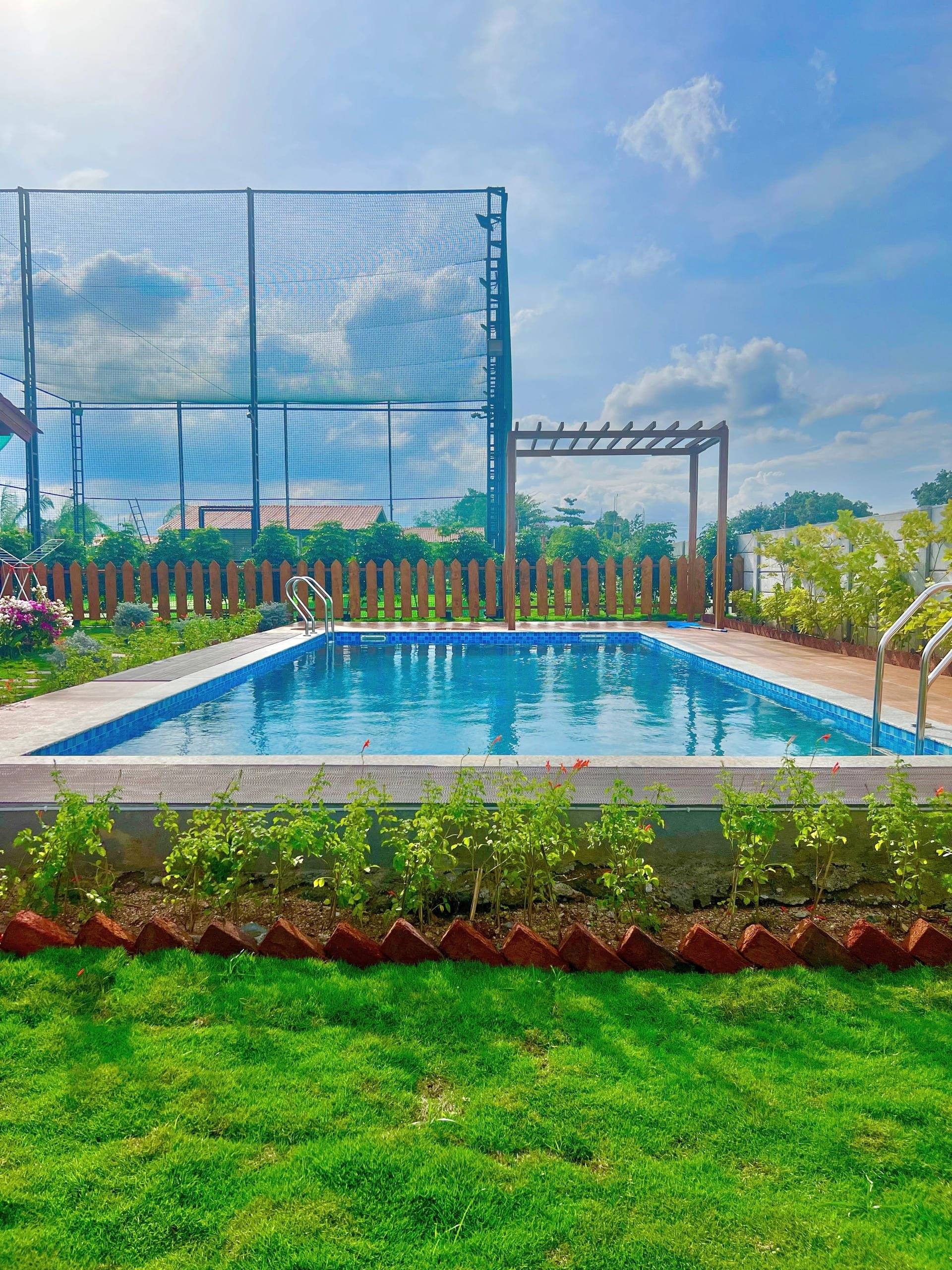 Pool and lawn with garden beds