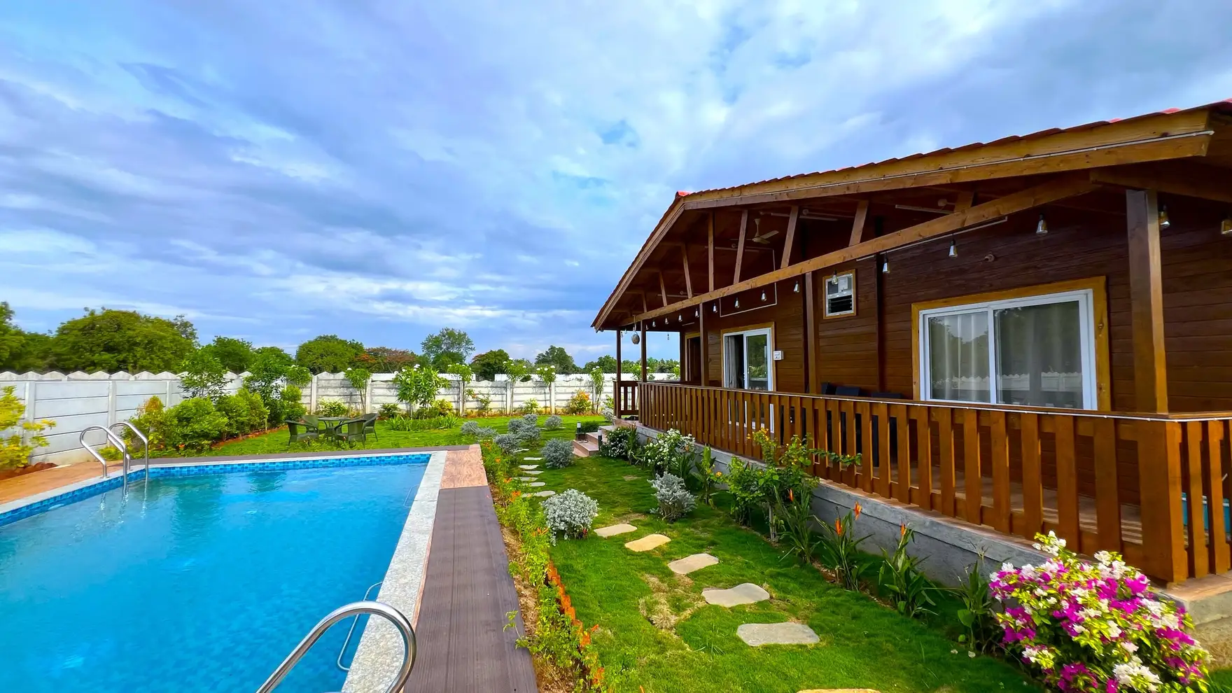 Wooden cottage beside the private swimming pool at AV Holistays, Moinabad