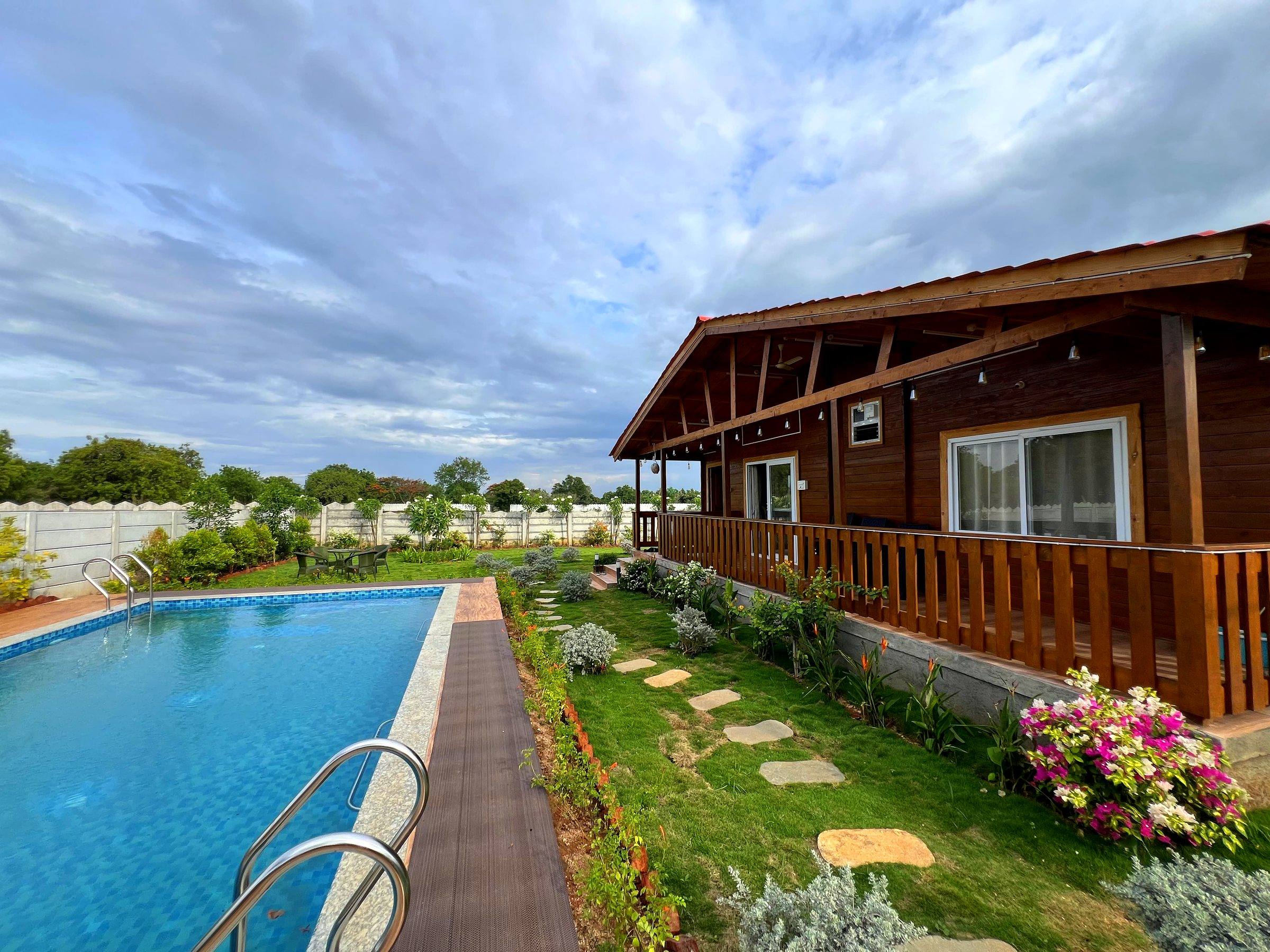 Both cottages share lawns and the pool deck